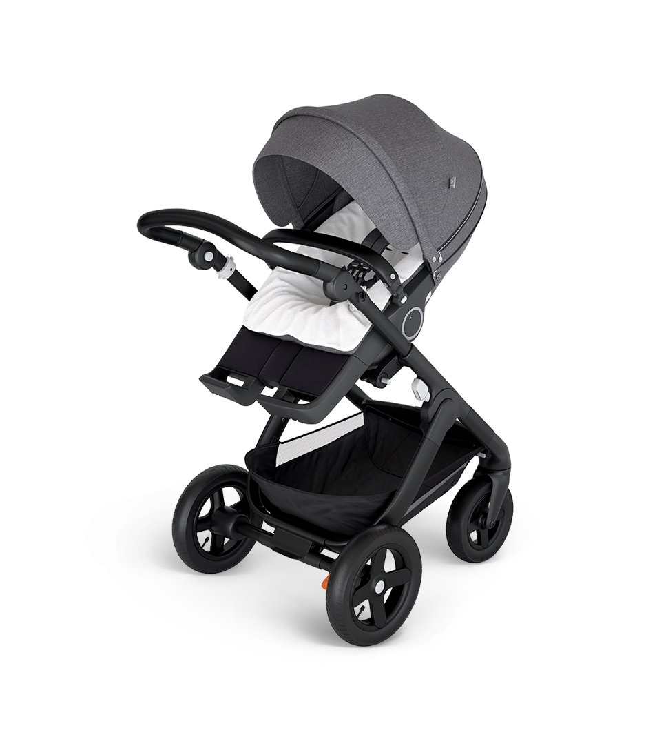 Stokke&reg; Trailz&trade; with Black Chassis and Stokke&reg; Stroller Seat Black Melange. Stokke&reg; Stroller Terry Cloth Cover.